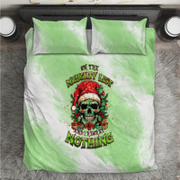 Christmas bedding set on gray rug: green/white duvet with skull Santa graphic and 2 pillows
