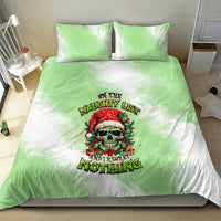 Christmas bedding set with green/white duvet and skull Santa graphic, plus two green pillows