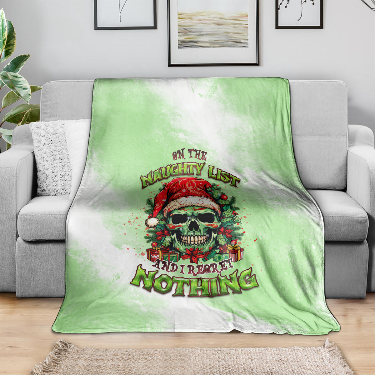 Christmas blanket with green gradient and skull Santa graphic, festive holiday text