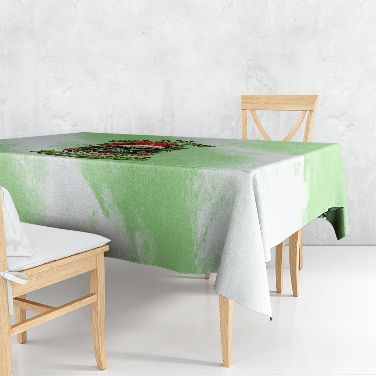 Green Christmas tablecloth with skull and wreath graphic, rectangular border