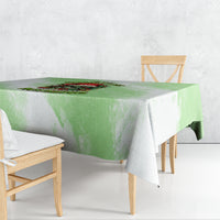 Green Christmas tablecloth with skull and wreath graphic, rectangular border