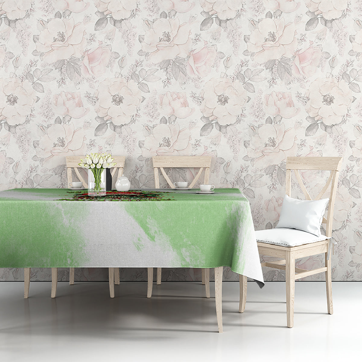 Green Christmas tablecloth with skull wreath print on long table with chairs