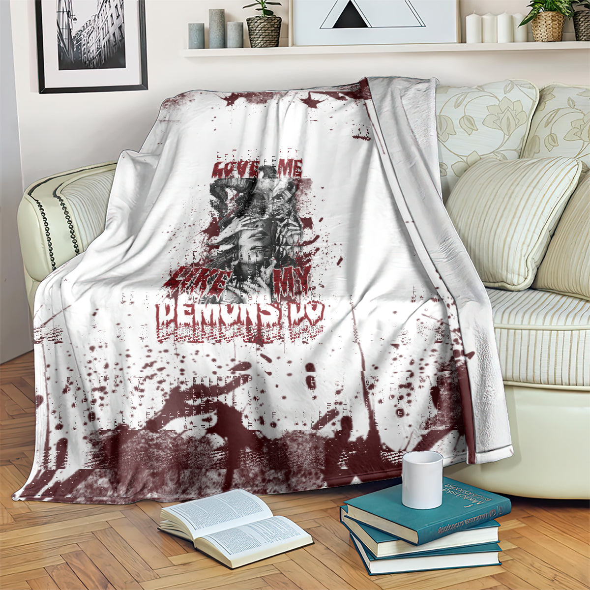 Skull graphic blanket over armrest: white with dark red splatter, skull portrait, and love text