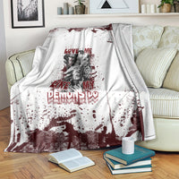 Skull graphic blanket over armrest: white with dark red splatter, skull portrait, and love text