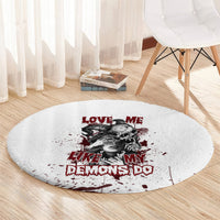 Round white graphic rug with red 'Love Me' text and black-gray skull portrait center