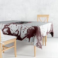 Skull tablecloth with dark maroon and white ink-splatter pattern, draped over table