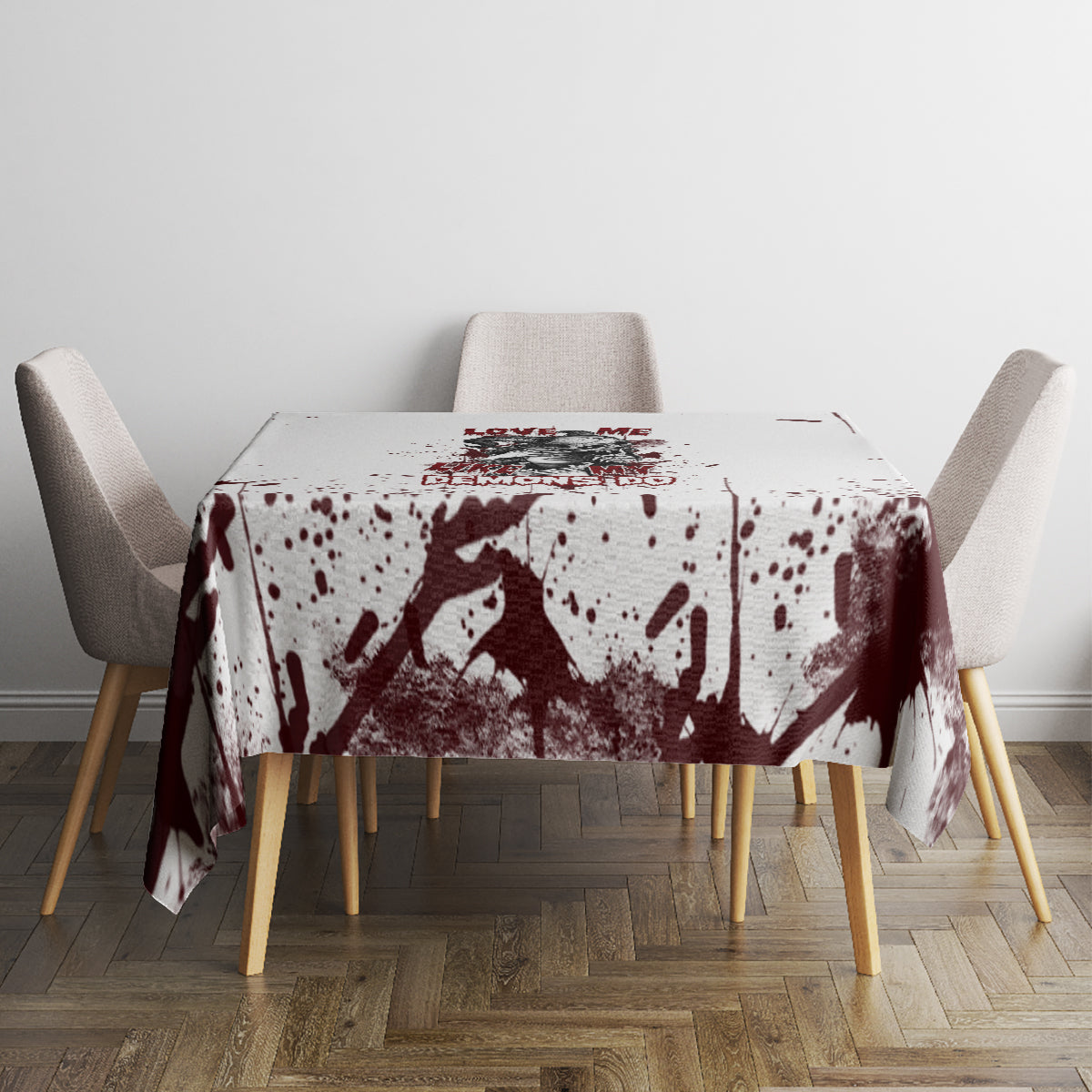 Skull tablecloth with maroon splatter and dark skull graphic, laid across round table