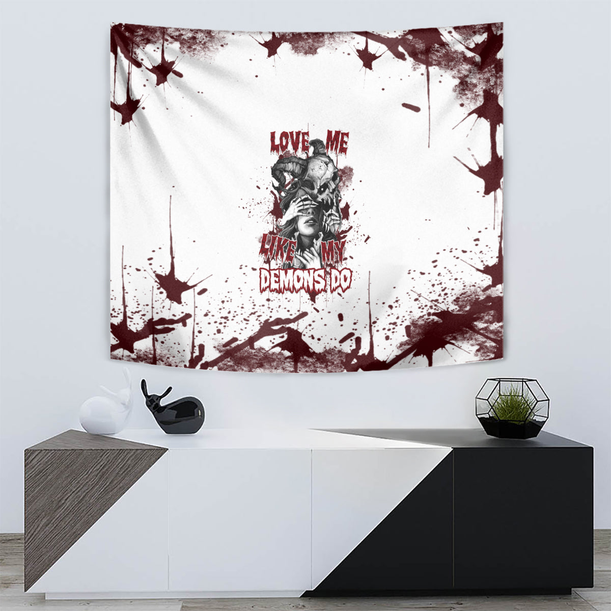 Skull artwork wall tapestry with maroon splashes and dark text accents on white