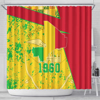 Mali shower curtain with grommet top, red side panels, and yellow-green map with 1960