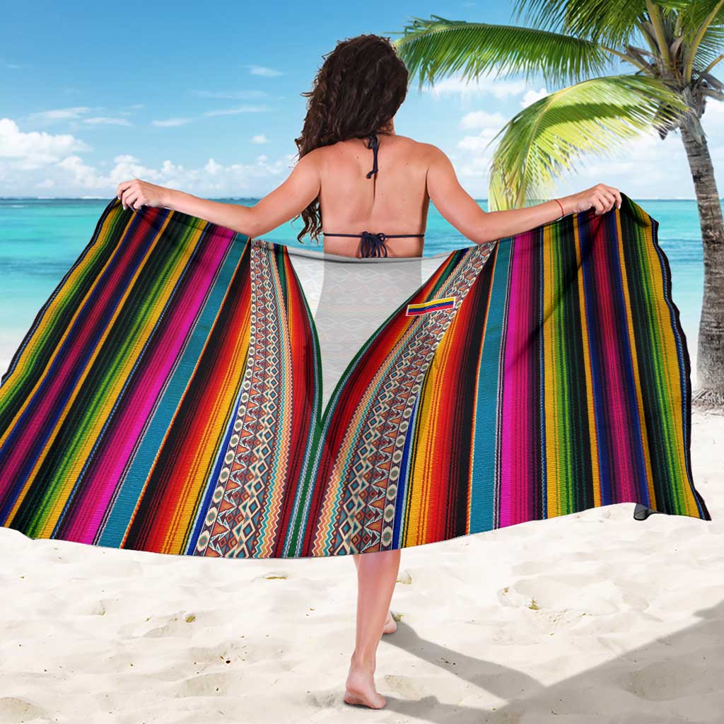 Multicolor vertical stripe woven sarong worn as a beach wrap