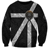Black unisex crewneck sweatshirt with circular skull emblem and white pattern panels