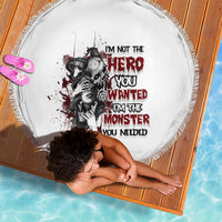 Round white beach blanket with fringe edge and red/black monster quote graphic