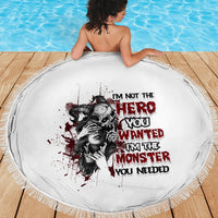 Round white beach blanket with fringe edge, red/black monster character text graphic