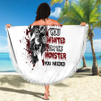 Round white beach blanket with fringe border and large centered monster quote graphic