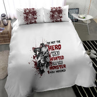 White bedding set with dark character collage and quote graphic on duvet and pillows