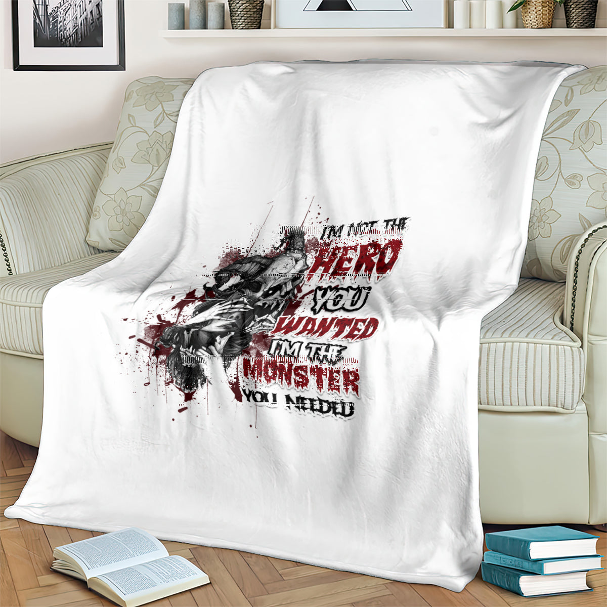 White blanket with black monster portrait graphic and red “hero wanted” style text