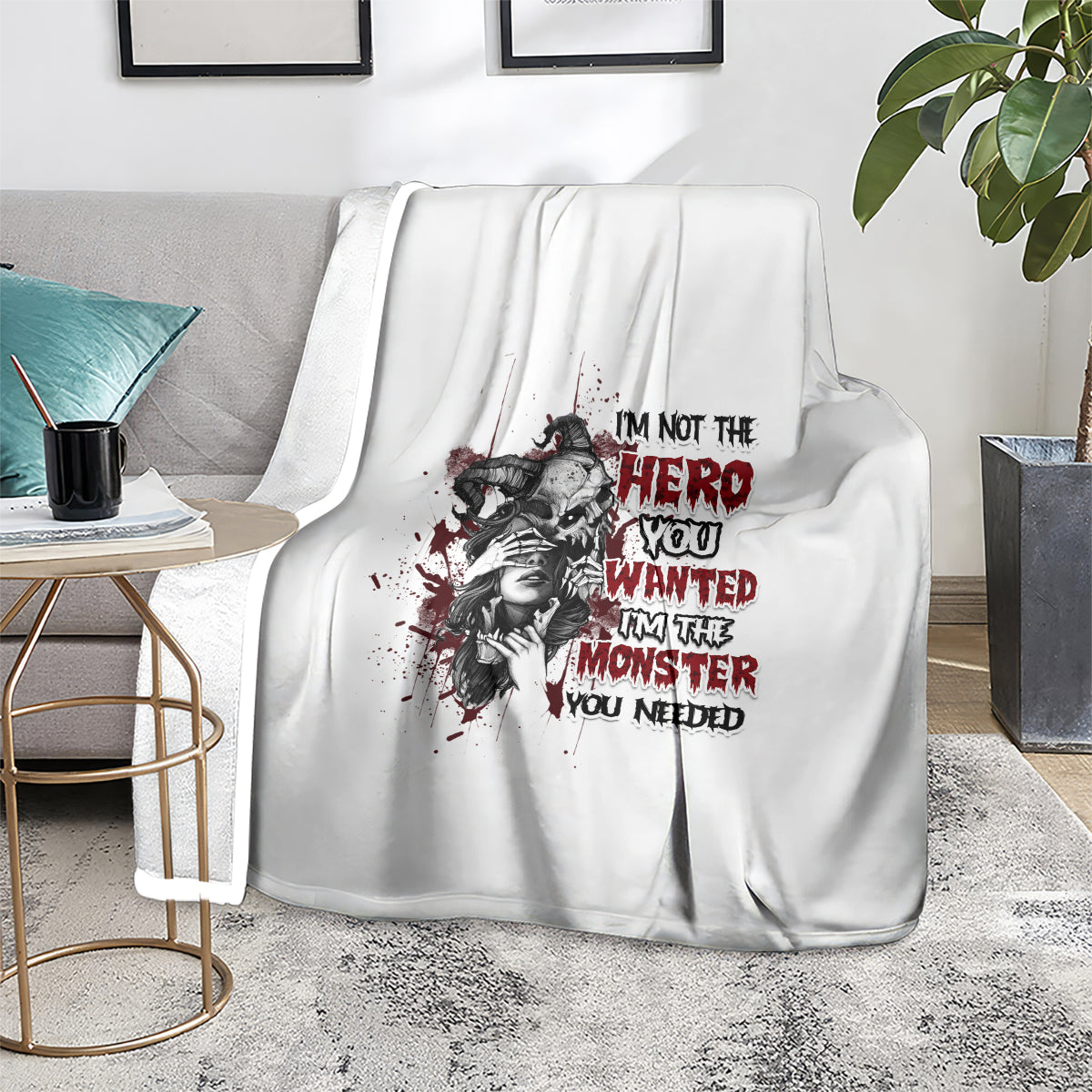 White blanket with black-and-red hero/monster portrait graphic and red slogan lettering