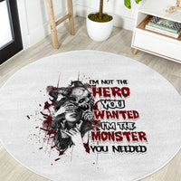 Light gray round carpet with dark and red illustrated woman face and slogan text