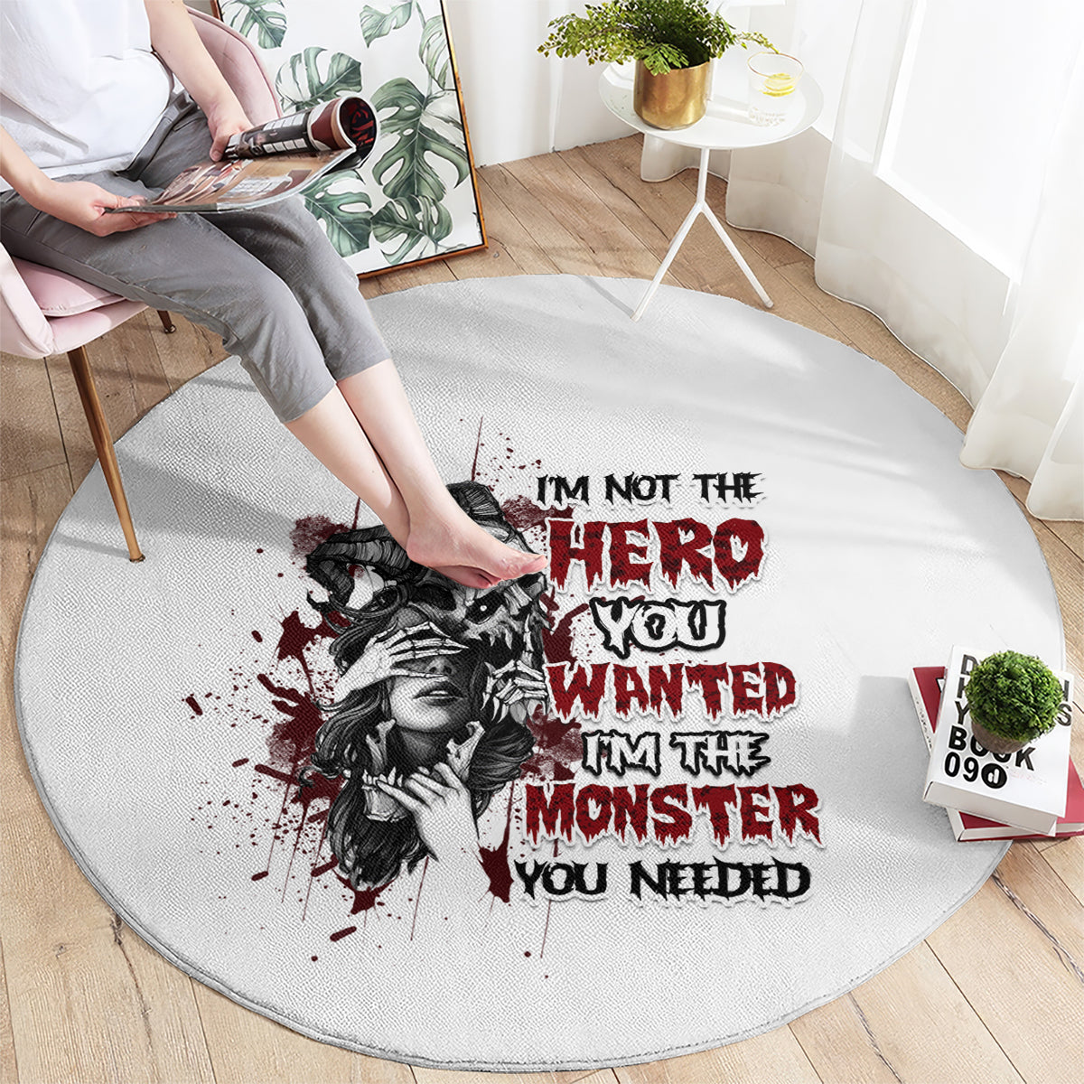 Light gray round carpet with black-and-red illustrated woman and bold slogan text
