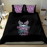 Black bedding set with winged skull and roses design, plus purple decorative pillowcases