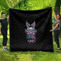 Black quilt with quilted diamond pattern and multicolor skull-wing rose graphic, banner text.