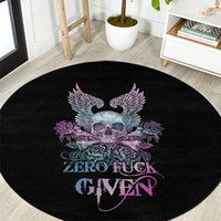 Round black carpet featuring a skull with purple wings, roses, and “ZERO FUCK GIVEN”