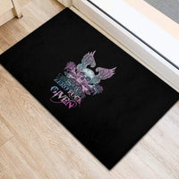 Black rubber doormat with skull wings, roses graphic and “ZERO FUCK GIVEN” text