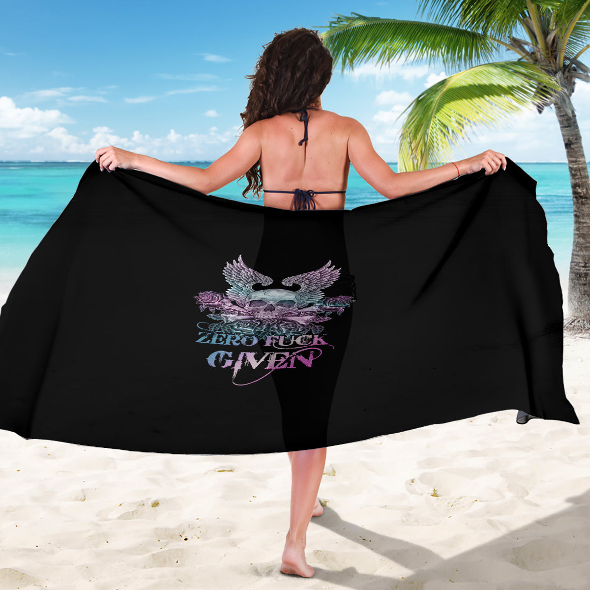 Black sarong with skull, wings, and roses graphic; draped hem