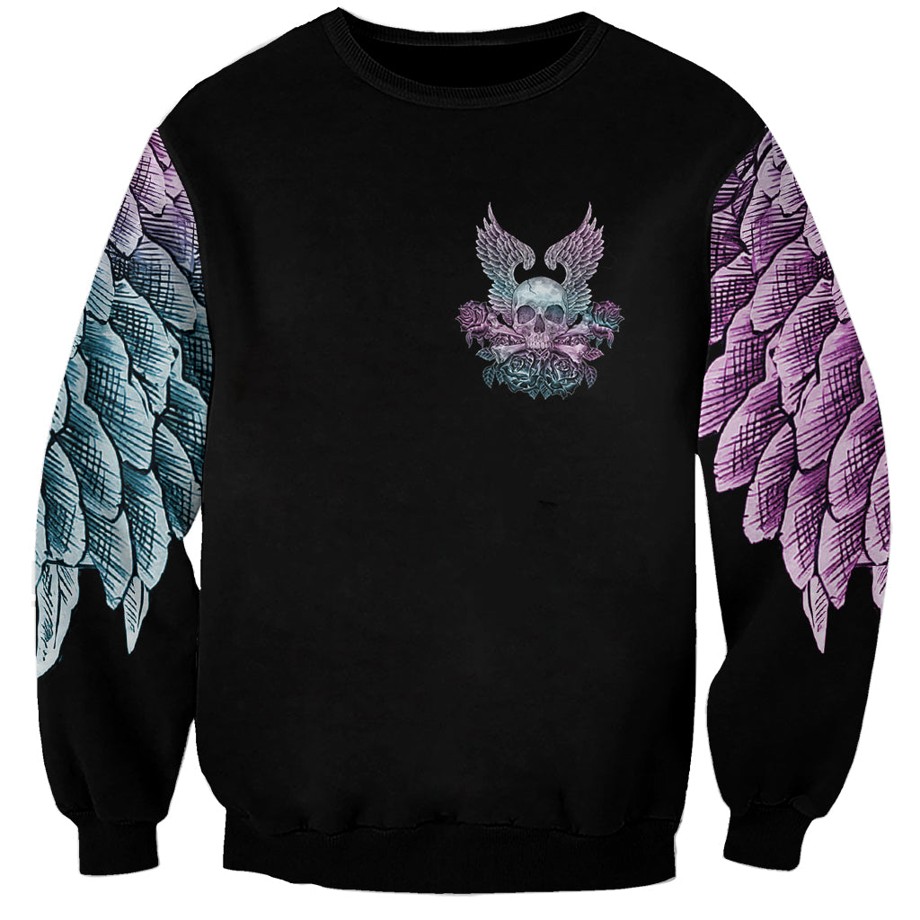 Unisex black sweatshirt with small winged skull and roses graphic on chest