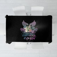 Black tablecloth top view with skull-wing rose graphic and 'ZERO FUCK GIVEN' text