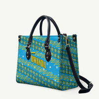 Rwanda Christmas Leather Bag with Blue-Yellow Pattern, Festive Geometric Motifs, and Bold Typography - Wonder Print Shop