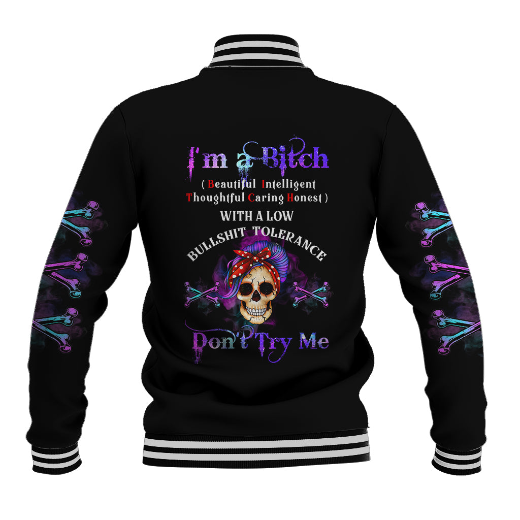 Black varsity baseball jacket with purple-and-blue skull graphic, striped ribbed collar and cuffs