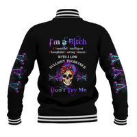 Black varsity baseball jacket with purple-and-blue skull graphic, striped ribbed collar and cuffs