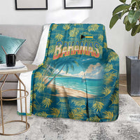 Tropical beach blanket on floor, featuring Bahamas text, palm pattern, and ocean view
