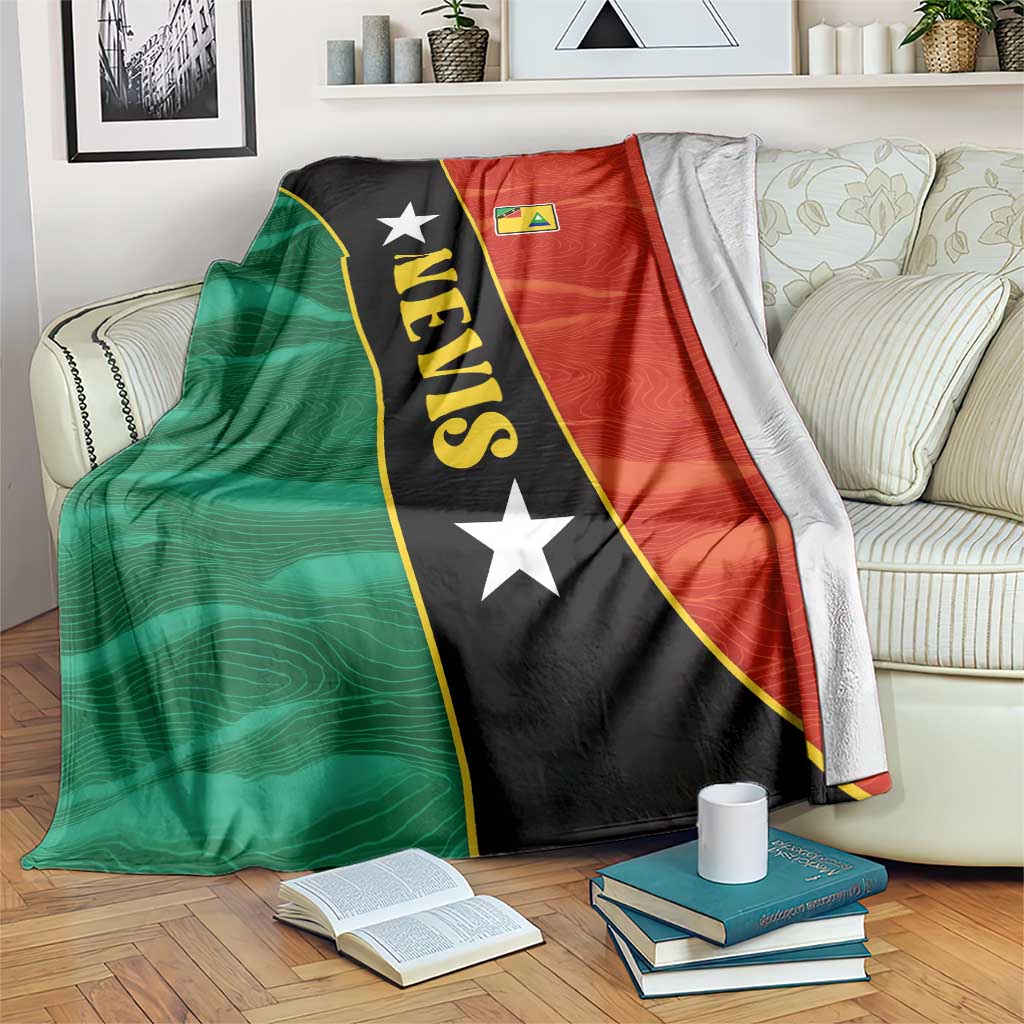 Flag-style blanket in green, red, and black with stars and vertical “NEVIS” text.