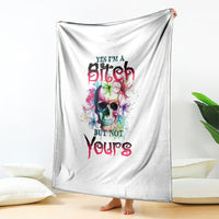 White blanket hanging display with colorful skull graphic and bold slogan text