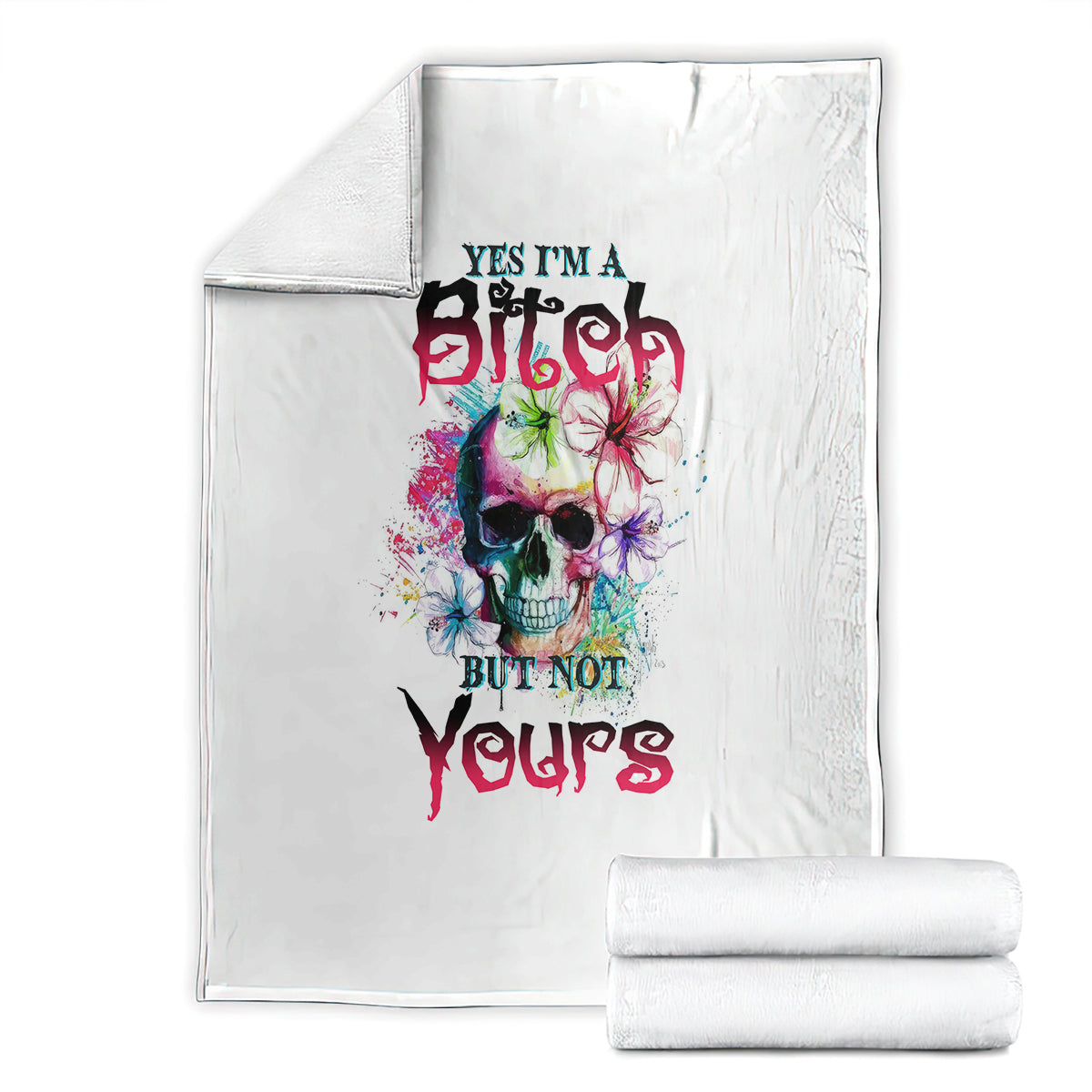 White folded blanket set with colorful skull graphic and bold slogan text