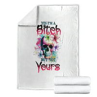 White folded blanket set with colorful skull graphic and bold slogan text