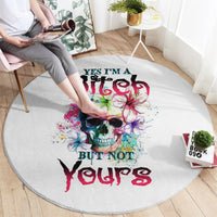 Round white carpet with multicolor skull graphic and graffiti-style text print.