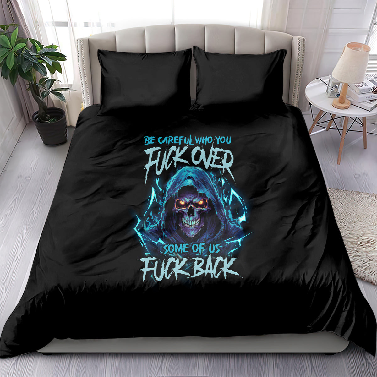 Black bedding set with blue skull graphic and bold slogan, with two matching pillows