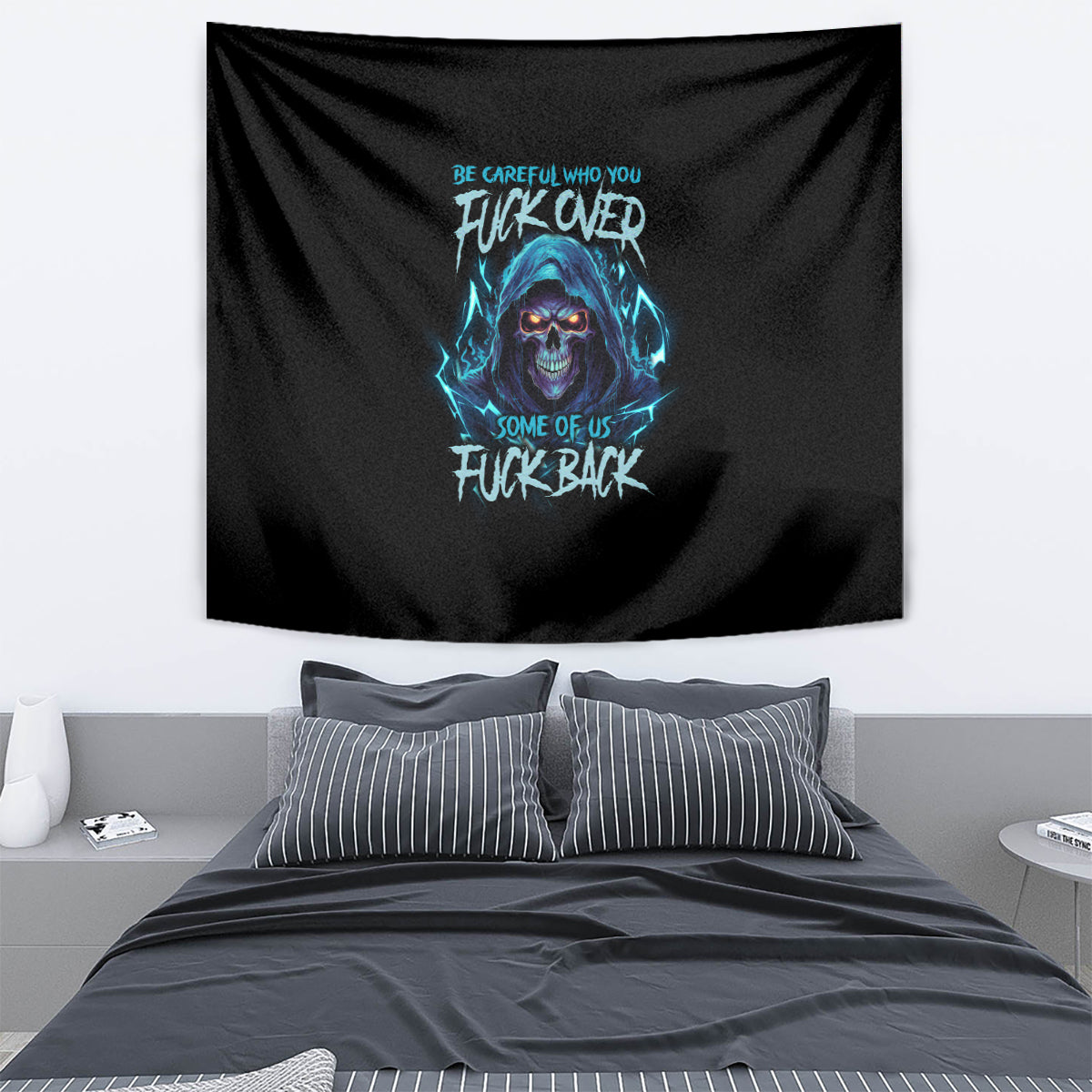 Black tapestry with blue wolf skull graphic and stylized text, hanging on wall