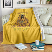Golden yellow reaper throw blanket folded with visible skull and sunflower floral print