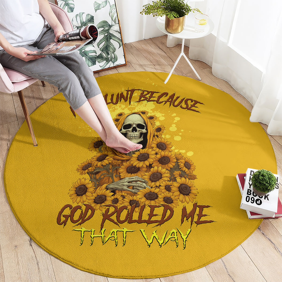 Yellow round carpet with skull and sunflowers; "God rolled me that way" lettering