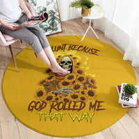 Yellow round carpet with skull and sunflowers; "God rolled me that way" lettering
