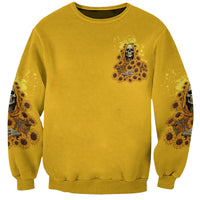 Unisex yellow sweatshirt with small center skull and sunflower reaper graphic