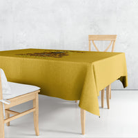 Yellow tablecloth with dark illustrated reaper graphic on the table surface