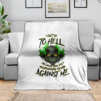 White skull graphic blanket with green fire-eyed skull and claw-text design