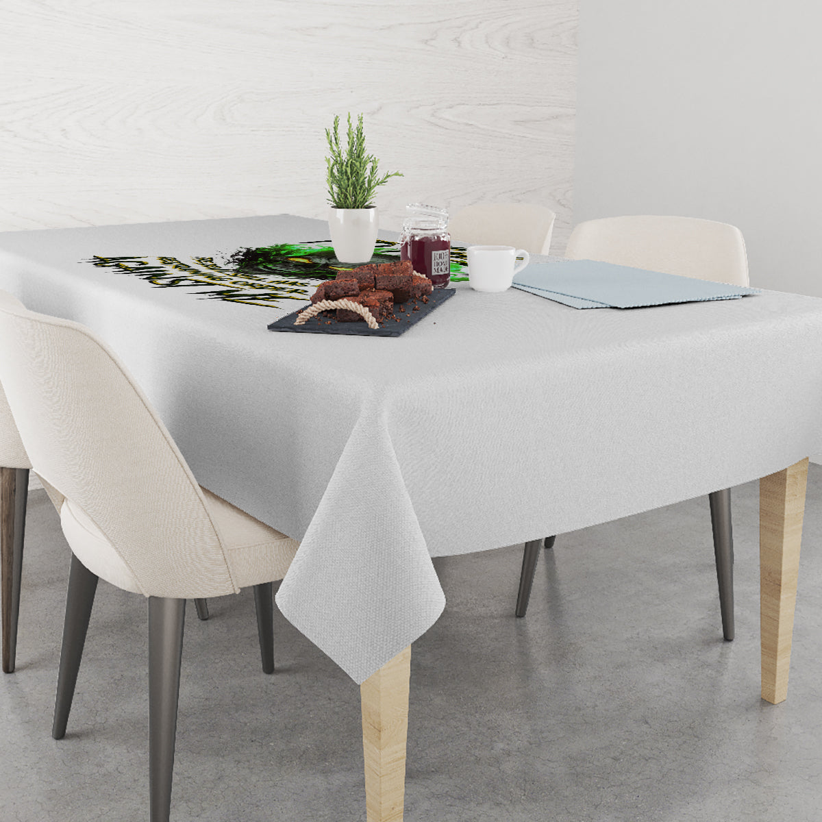 Rectangular tablecloth with green skull graphic and dark lettering across the center