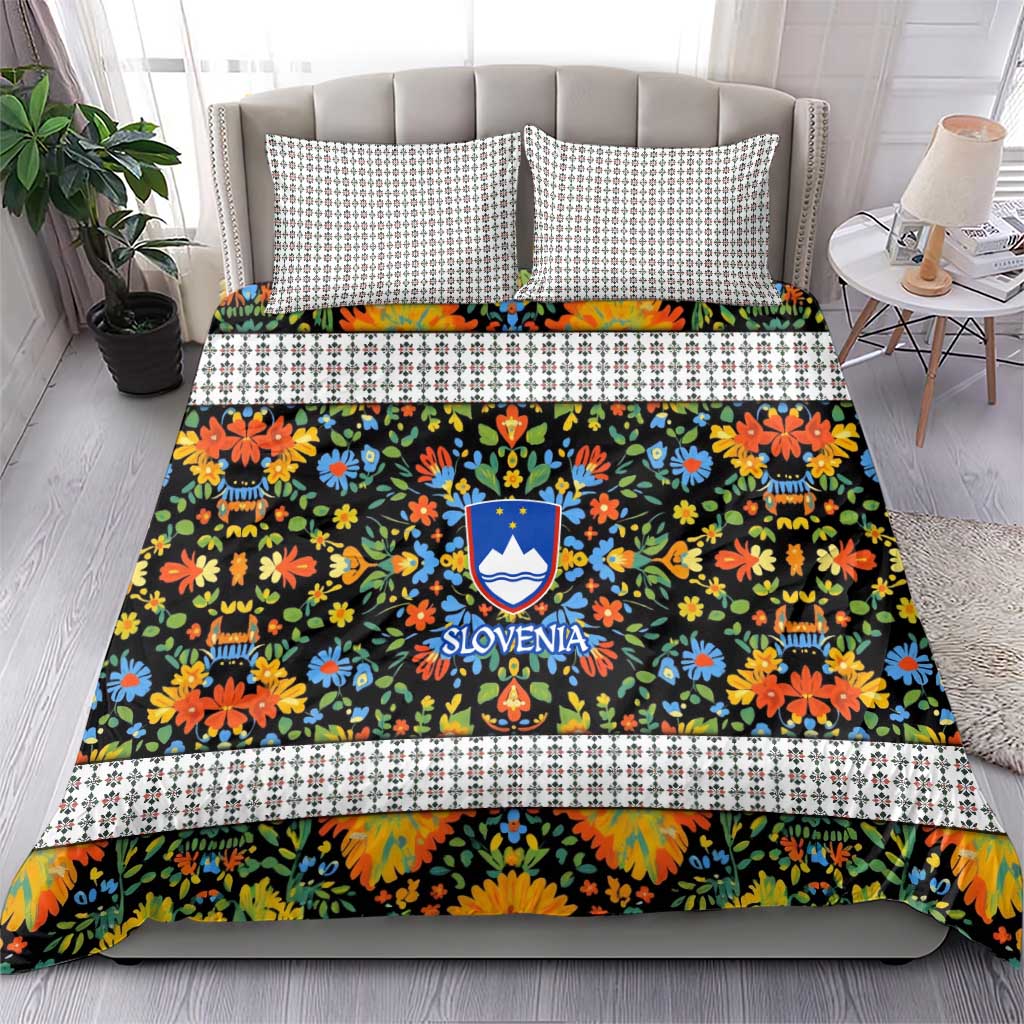 Folk art bedding set with duvet and pillows featuring multicolor flowers and Slovenia crest