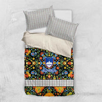 Folk art bedding set flat lay with multicolor floral duvet front and two patterned pillowcases